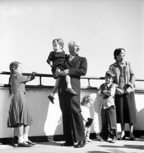 Charlie with family wife - Oona, Michael 6 1/2, Geraldine 8, Josepaine 3 1/2 Charlie with family wife - Oona, Michael 6 1/2, Geraldine 8, Josepaine 3 1/2