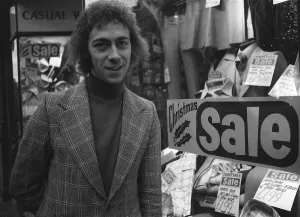 Charlie George football player of Arsenal December 1974 outside a men clothing Charlie George football player of Arsenal December 1974 outside a men clothing