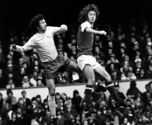 Charlie George Football Player March 1973 jumps with Roy McFarland for the ball Charlie George Football Player March 1973 jumps with Roy McFarland for the ball