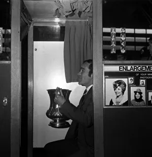Chelsea captain Ron Harris sits in the Photo booth on Piccadilly station with the FA Cup Chelsea captain Ron Harris sits in the Photo booth on Piccadilly station with the FA Cup