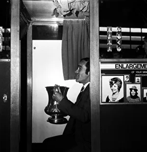 Chelsea captain Ron Harris sits in the Photo booth on Piccadilly station with the FA Cup Chelsea captain Ron Harris sits in the Photo booth on Piccadilly station with the FA Cup