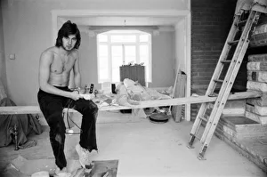 Chelsea footballer Alan Hudson takes a break from DIY at his Putney home, May 1972 Chelsea footballer Alan Hudson takes a break from DIY at his Putney home, May 1972