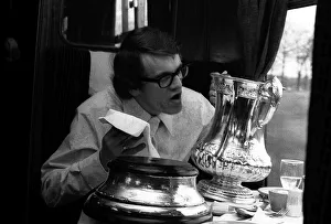 Chelsea's Eddie MaCreadie on his way back to London on the train polishes up the FA Chelsea's Eddie MaCreadie on his way back to London on the train polishes up the FA