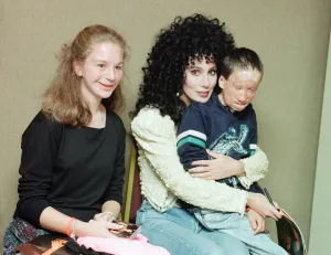 Cher, American singer, presents cheque for 15,000 pounds to representatives of Cher, American singer, presents cheque for 15,000 pounds to representatives of
