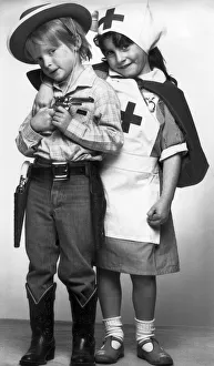Childre dressed up as cowboy and nurses. 16th April 1985 Childre dressed up as cowboy and nurses. 16th April 1985