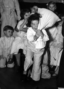 Children at bedtime have a pillow fight before bed. 23rd October 1950 Children at bedtime have a pillow fight before bed. 23rd October 1950