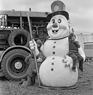 Children climbing on large snowman figure at Silcocks Fair at Skelmersdale 17th May 1973 Children climbing on large snowman figure at Silcocks Fair at Skelmersdale 17th May 1973
