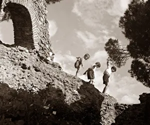 Children climbing amongst the ruins of a castle circa 1950 childhood holidays Children climbing amongst the ruins of a castle circa 1950 childhood holidays