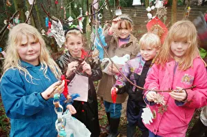 Children decorating trees with christmas decorations in Hancocks Wood, Loftus Children decorating trees with christmas decorations in Hancocks Wood, Loftus
