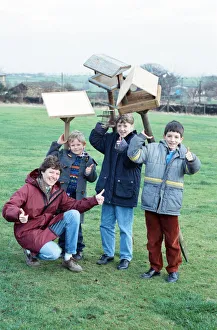 Children at Emley First School with bird tables donated to the school after an appeal in Children at Emley First School with bird tables donated to the school after an appeal in