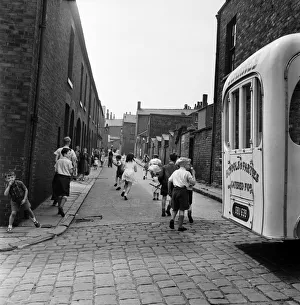 Children playing in the streets of Oldham. July 1952 C3299-001 Children playing in the streets of Oldham. July 1952 C3299-001