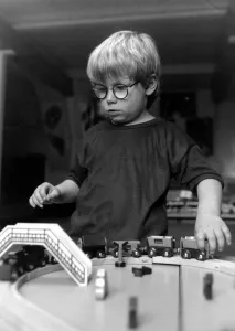 Children - Toys Young Boy playing with a Train Set - at a creche at Kingway Children - Toys Young Boy playing with a Train Set - at a creche at Kingway