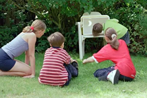 Children watching the solar eclipse indirectly at Hightown. 11th August 1999 Children watching the solar eclipse indirectly at Hightown. 11th August 1999