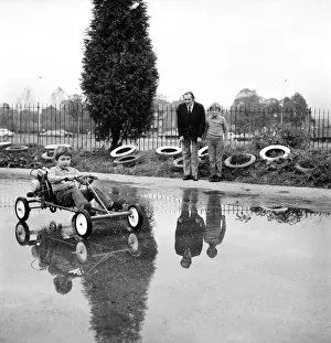 ChildrenIs Go-kart: Richard Spicer aged 5, driving the Kiddies Go Kart watched by Roy ChildrenIs Go-kart: Richard Spicer aged 5, driving the Kiddies Go Kart watched by Roy