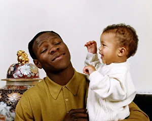 Chris Eubank boxer holding his baby in his arms Chris Eubank boxer holding his baby in his arms