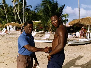 Chris Eubank Boxing shaking hands with man on beach Chris Eubank Boxing shaking hands with man on beach