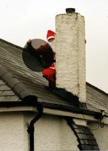 Christmas - Satellite and tv aerial installer Matthew Bloom dressed as Father Christmas Christmas - Satellite and tv aerial installer Matthew Bloom dressed as Father Christmas