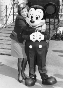 Cilla Black with Disney characters in Battersea park at the giant model which Disney Cilla Black with Disney characters in Battersea park at the giant model which Disney