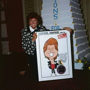 Cilla Black September 1988 holding poster of herself presented by Daily Record Cilla Black September 1988 holding poster of herself presented by Daily Record