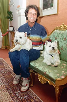 Cliff Richard with his two dogs. 17th June 1995 Cliff Richard with his two dogs. 17th June 1995