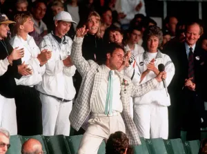 Cliff Richard entertains the tennis fans during a break in play due to the weather Cliff Richard entertains the tennis fans during a break in play due to the weather