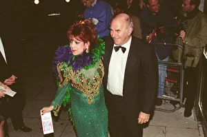 Clive James arrives for the 1995 Comedy Awards with Margarita Pracatan Clive James arrives for the 1995 Comedy Awards with Margarita Pracatan
