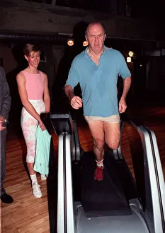 Clive James TV presenter on treadmill February 1990 On running machine Clive James TV presenter on treadmill February 1990 On running machine