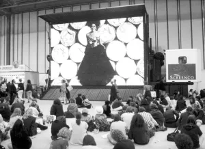 Clothes Show Live, visitors to the clothes show relax beneath one of the giant video Clothes Show Live, visitors to the clothes show relax beneath one of the giant video