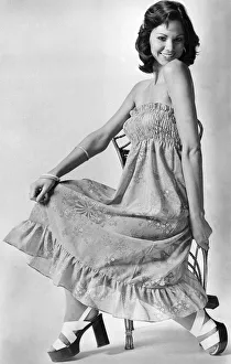 Clothing. Above: show a bare midriff between the skirt and ruched tip Clothing. Above: show a bare midriff between the skirt and ruched tip