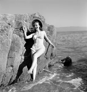 Clothing: Fashion: Beachwear: Holidaymakers: Bathing: Beauties seen here cooling off in Clothing: Fashion: Beachwear: Holidaymakers: Bathing: Beauties seen here cooling off in