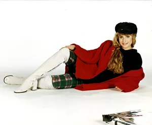 Clothing Fashion from Miss Selfridge model in white boots tartan leggings black top hat Clothing Fashion from Miss Selfridge model in white boots tartan leggings black top hat