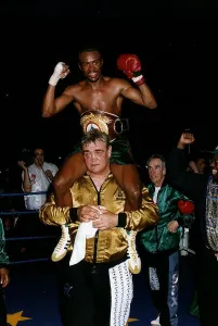 Colin McMillan Boxing sits on the shoulders of one of his seconds after winning the WBO Colin McMillan Boxing sits on the shoulders of one of his seconds after winning the WBO