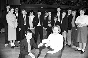 Colne Valley High School pupils Steven Clegg and Lemini Whitley with a £ Colne Valley High School pupils Steven Clegg and Lemini Whitley with a £