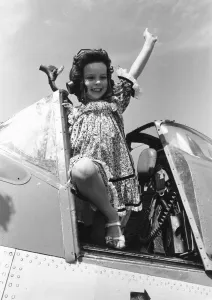 Come Fly With Me. Little Lucy Deplidge seen here waving from the cockpit of a Fleet Air Come Fly With Me. Little Lucy Deplidge seen here waving from the cockpit of a Fleet Air