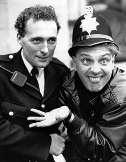 Comedian and actor Rik Mayall pictured with PC David Jones Comedian and actor Rik Mayall pictured with PC David Jones