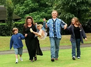 Images Dated 12th September 1998: Comedian Rik Mayall with his family, wife Barbara and three children, Rosie