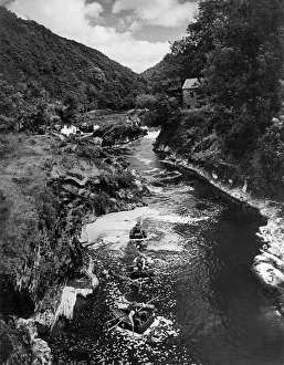 Coracle fishers on the River Teifi at Cenarth: Following a pattern evolved over two Coracle fishers on the River Teifi at Cenarth: Following a pattern evolved over two