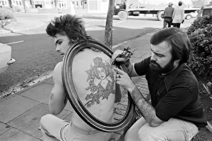 Council gardener Ian Hewison is so proud of the Chinese girl tattooed on his back he' Council gardener Ian Hewison is so proud of the Chinese girl tattooed on his back he'
