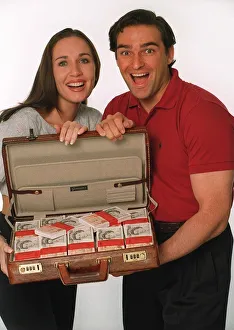 Couple with Suitcase of Money - Daily Mirror Promotion Couple with Suitcase of Money - Daily Mirror Promotion