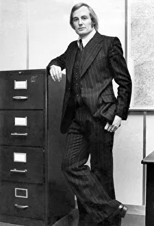 Coventry and England rugby union player Dave Duckham wearing a suit as he works in his Coventry and England rugby union player Dave Duckham wearing a suit as he works in his