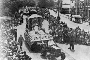 Coventry's Coronation Carnival procession with the main tableau carrying the carnival Coventry's Coronation Carnival procession with the main tableau carrying the carnival