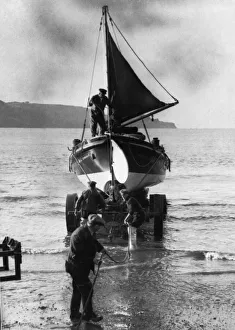 Coxswain Tom Patton and engineer Bob Taylor assisting in the launch of a lifeboat at Coxswain Tom Patton and engineer Bob Taylor assisting in the launch of a lifeboat at