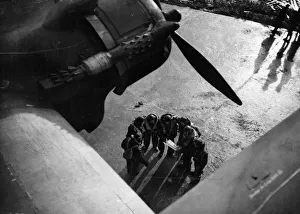 The crew of a Stirling bomber consulting a map. February 1942 The crew of a Stirling bomber consulting a map. February 1942