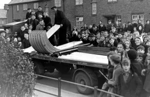 A crowd of excited youngsters watched the delivery of the first consignment of ARP air A crowd of excited youngsters watched the delivery of the first consignment of ARP air