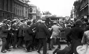 Crowds cheering Prime Minister Herbert Asquith as he returns from parliament following Crowds cheering Prime Minister Herbert Asquith as he returns from parliament following
