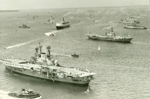 The Cunard liner QEII cruises through the fleet of Royal Navy ships gather at Spithead The Cunard liner QEII cruises through the fleet of Royal Navy ships gather at Spithead
