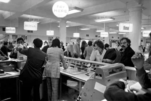 Customers at the Cash Desk in the Electrical section of Selfridges during a sale Customers at the Cash Desk in the Electrical section of Selfridges during a sale