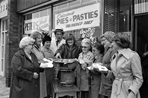 Customers waiting for their meat pies to warm up on the Calor gas cooker provided by Customers waiting for their meat pies to warm up on the Calor gas cooker provided by