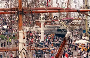 Cutty Sark Tall Ships Race July 1999 crowds in Greenock on the quayside with ships in Cutty Sark Tall Ships Race July 1999 crowds in Greenock on the quayside with ships in