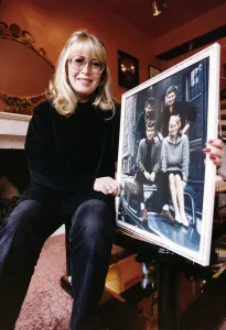 Cynthia Lennon ex wife of the late John Lennon at home with an early picture of her with Cynthia Lennon ex wife of the late John Lennon at home with an early picture of her with
